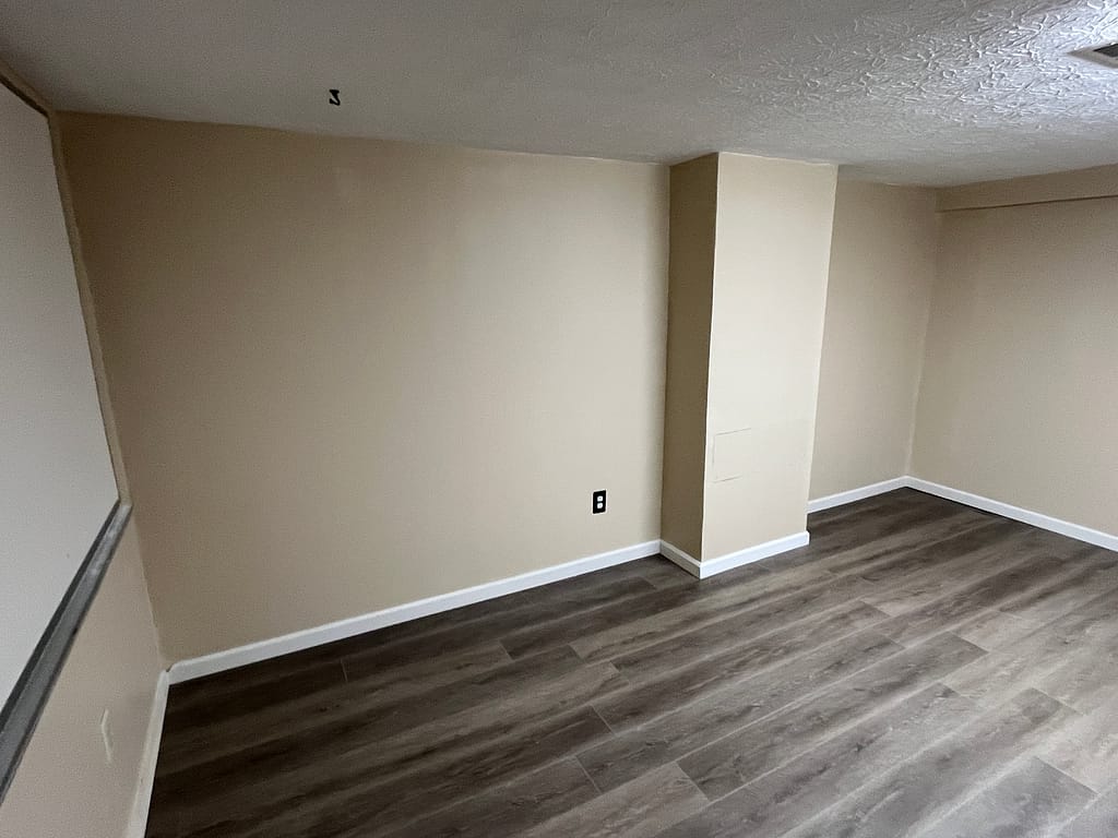 Basement remodel: hang drywall, joint compound, paint, install floors and baseboard