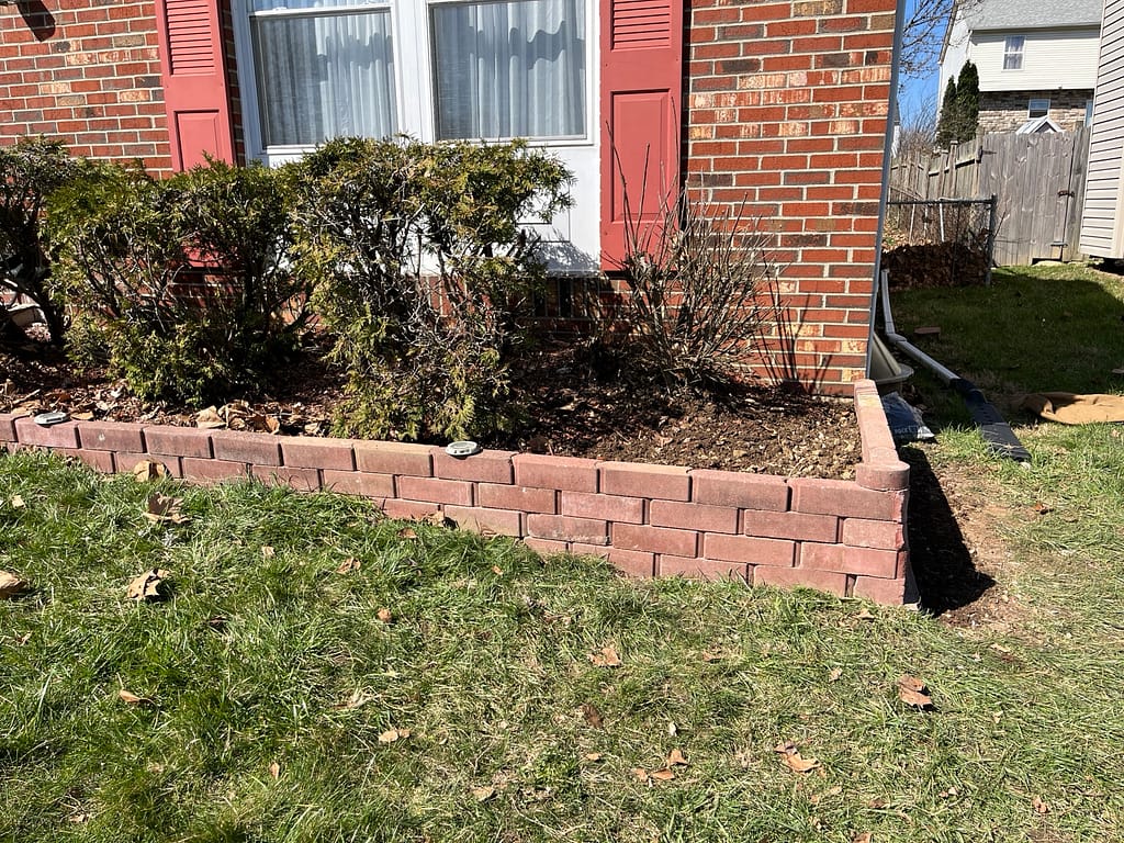 Reinforced brick retaining wall